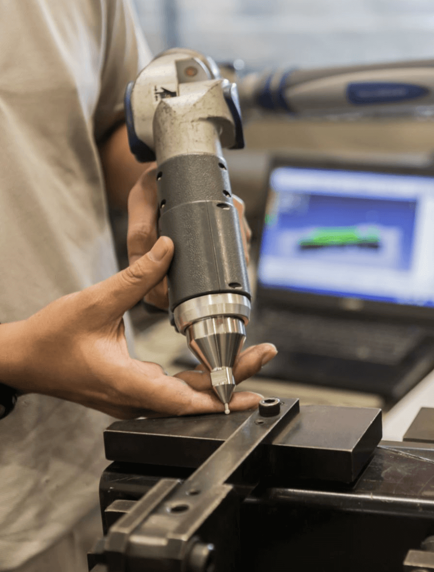 Photo of operator using a cobot assistant