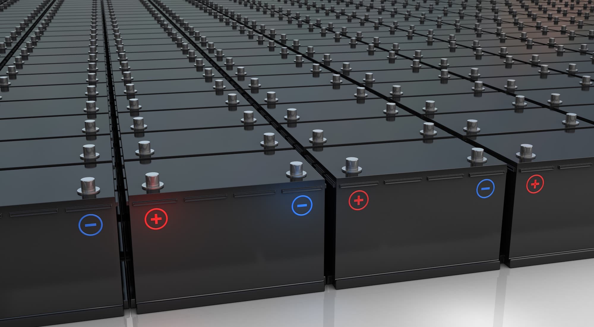 rows of automotive battery cells arranged in a production assembly, illustrating battery manufacturing at scale